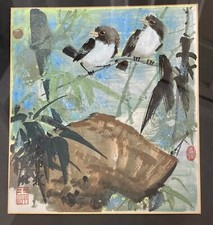 Uccellini su ramo di bambù